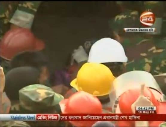 Bangladeshi TV showed the woman being taken to an ambulance. Screengrab: SomoyTV