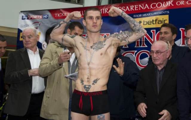 Ricky Burns flexes his muscles at the weigh-in ahead of tonights fight with Jose Gonzalez. Picture: SNS