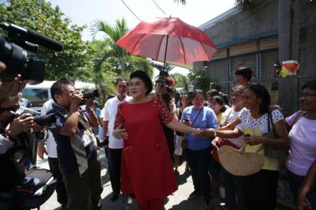 Imelda Marcos, centre, greets supporters in Ilocos Norte province ahead of congressional elections on Monday. Picture: AP