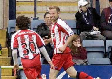 Rory McKenzie and Chris Johnston celebrate a Kilmarnock goal. Picture: SNS