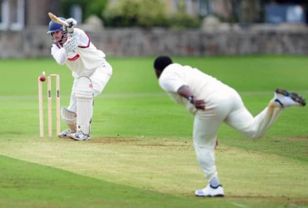 Watsonians batsman Craig Wright is bowled by Abroath's Alvin Pollard at Myreside yesterday. Picture: Ian Rutherford