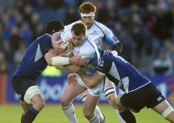 Stuart Hogg causes problems for Shane Jennings and Kevin McLaughlin. Picture: SNS