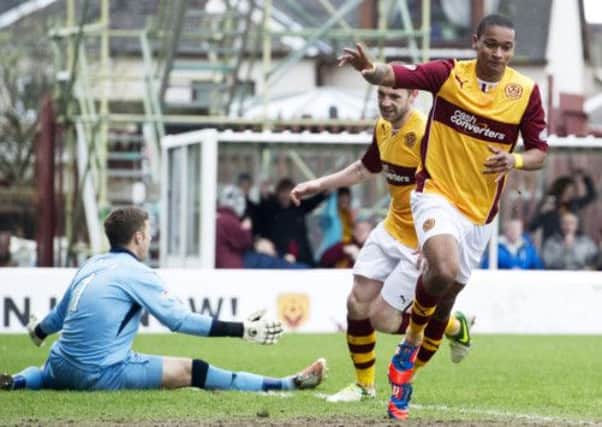 Motherwell star Chris Humphrey wheels away to celebrate after doubling his side's lead. Picture: SNS