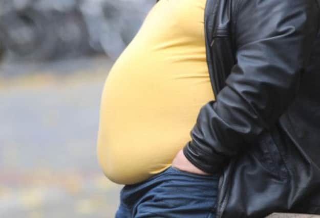 Being overweight or obese is second only to smoking as the biggest risk factor for several types of cancer. Picture: PA