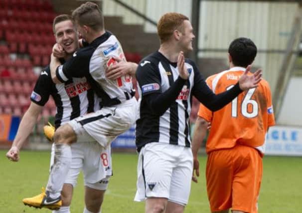 Stephen Husband is congratulated by team-mate Josh Falkingham after netting during their play-off victory over Forfar at East End Park. Picture: SNS