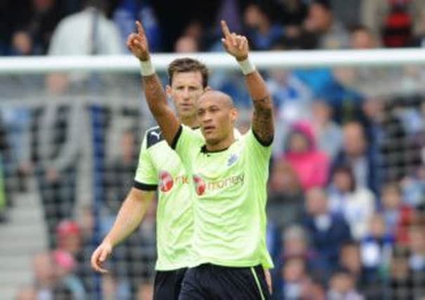 Newcastle United's Yoan Gouffran celebrates scoring his side's second goal during yesterday's mustwin clash against QPR at Loftus Road. Picture: PA