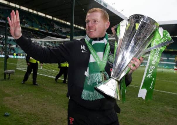 Neil Lennon with the SPL trophy. Picture: SNS