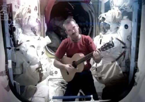 A Youtube screengrab of Commander Chris Hadfield as he performs the cover. Picture: PA/Youtube