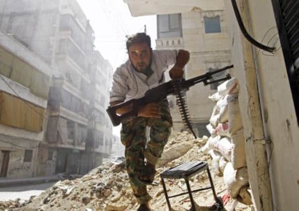 David Cameron has pledged to double military support for Syrian rebel forces. Picture: Reuters