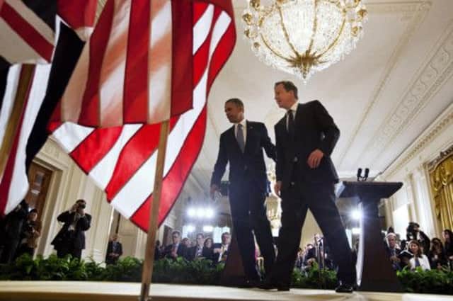 Barack Obama and David Cameron leave the stage after their press conference at the White House. Picture: AP