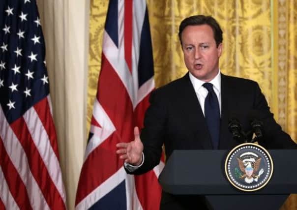 David Cameron speaks during a joint press conference with Barack Obama at the White House yesterday. Picture: Getty