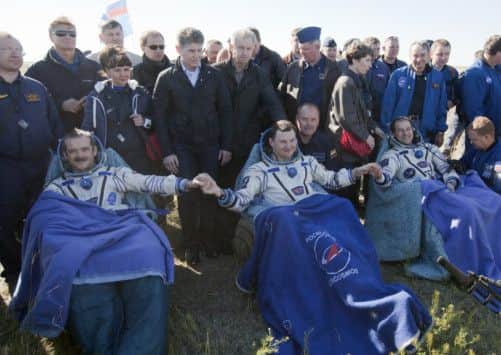 Thomas Marshburn, right, Roman Romanenko, center, and Canadian astronaut Chris Hadfield. Picture: Ap