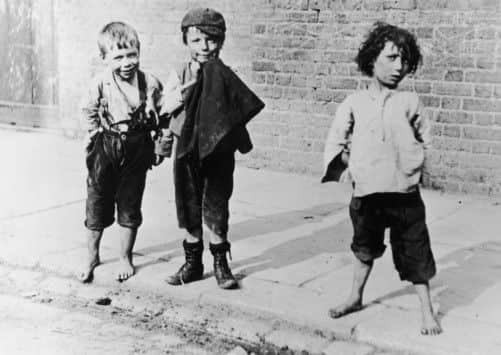 circa 1895:  Barefooted slum children of London in the late 19th century.  Collection - Leonard Russell  (Photo by Hulton Archive/Getty Images)