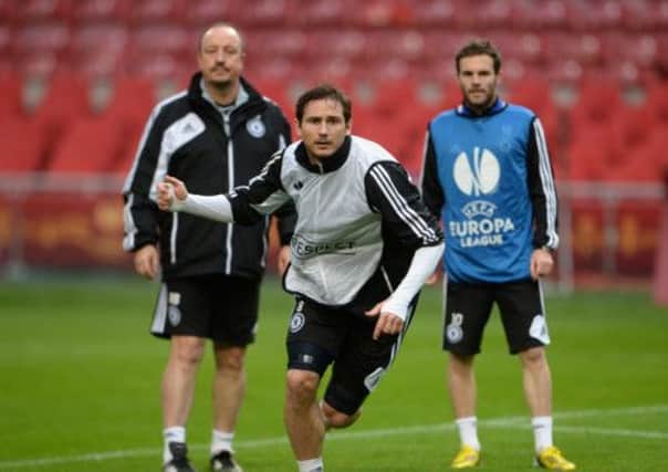 Frank Lampard, with manager Rafa Benitez and teammate Juan Mata, at a training session in Amsterdam. Picture: Getty