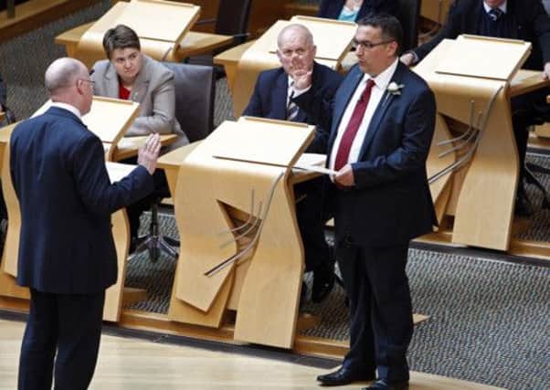 Christian Allard  was sworn in today when he made the affirmation on the floor of the Debating Chamber. Picture: Scottish Parliament