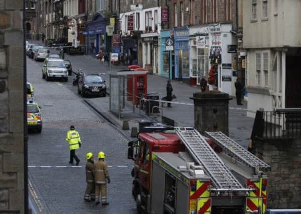 Police and firefighters at the scene earlier this evening. Picture: PA