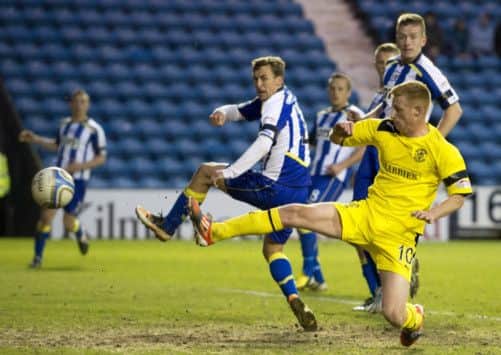 Eoin Doyle pokes home the first of his two goals. Picture: SNS
