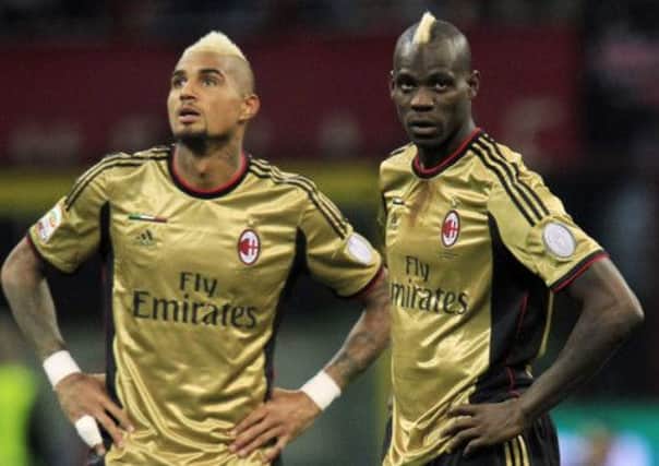 Balotelli, with teammate Kevin Prince-Boateng. The pair were racially abused by Roma fans this weekend. Picture: Reuters