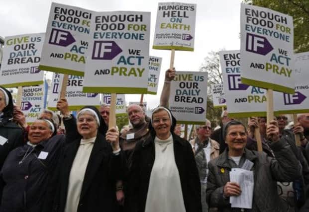 Nuns, priests and supporters march through central London. Picture: AP