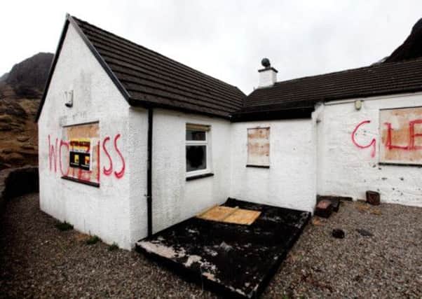 Savile's former home, daubed with graffiti. Picture: Gordon Jack