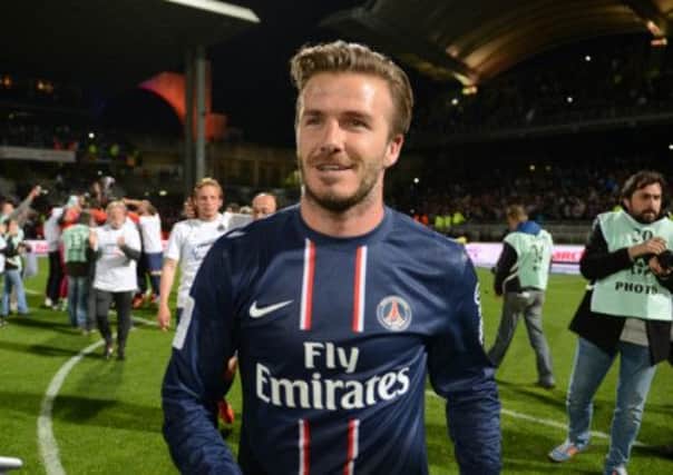 David Beckham celebrates title victory with Paris St Germain. Picture: AFP