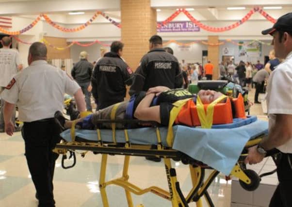 A casualty of the tornado is carried to an ambulance in Granbury, Texas. Picture: AP