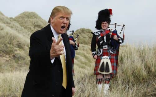 RNPS IMAGES OF THE YEAR 2010 - U.S. property mogul Donald Trump gestures during a media event on the sand dunes of the Menie estate, the site for Trump's proposed golf resort, near Aberdeen, north east Scotland May 27, 2010.  REUTERS/David Moir (BRITAIN POLITICS - Tags: SPORT GOLF BUSINESS)