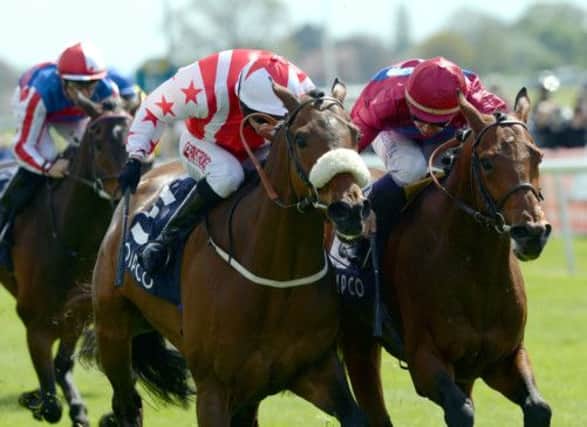 Tony Hamilton rides Glens Diamond to victory in the Qipco Yorkshire Cup at York yesterday. Picture: PA