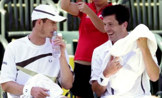 Tim Henman playing doubles with Andy Murray in the US in 2007. Picture: Reuters