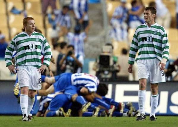 Neil Lennon, left, and Chris Sutton are stunned as Porto celebrate their winner in the Uefa Cup final. Picture: Reuters