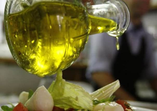 The EU has proposed to ban olive oil served in jugs like these in order to prevent widespread fraud. Picture: Reuters