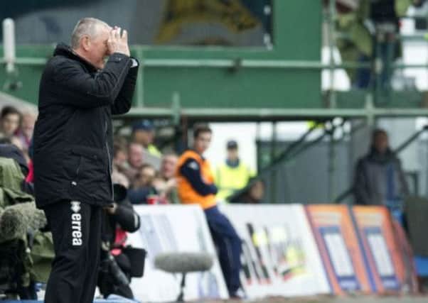 Terry Butcher tries in communicate with his team, who lost 1-0 to Ross County. Picture: SNS