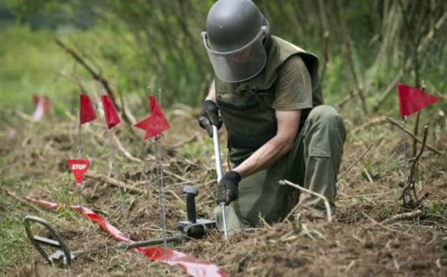 A mine clearer searches for land mines left over from the 1990s Balkans war, in Petrinja, central Croatia. Picture: AP