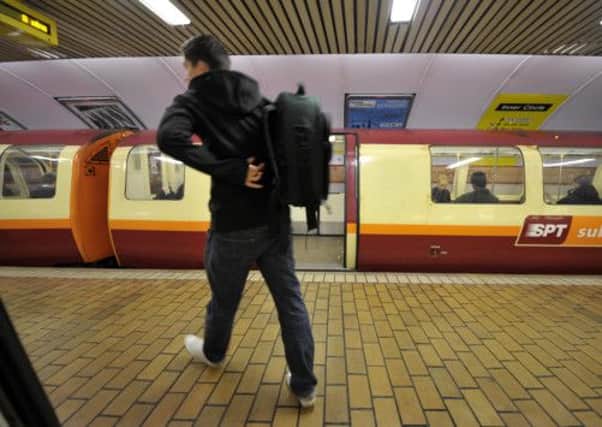 A passenger uses Glasgow's subway, nicknamed the Clockwork Orange. Picture: Donald Macleod
