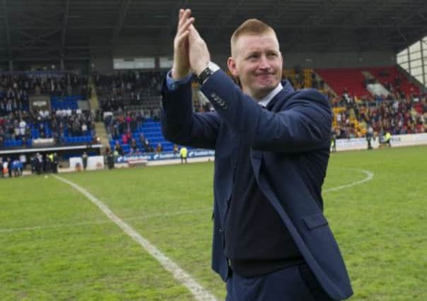 Steve Lomas salutes the home supporters after securing Europa League football for next season. Picture: SNS