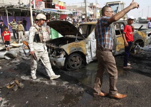 At least 13 people died in two car bomb attacks in BasraPicture: Ramzi al-Shaban/AFP/Getty Images