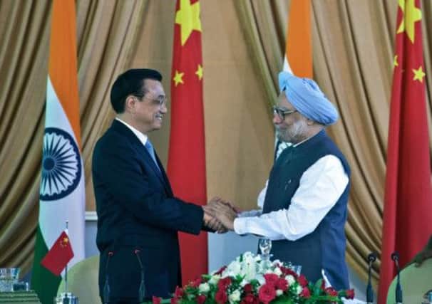 Li Keqiang and Manmohan Singh meet in New Delhi. Picture: Getty