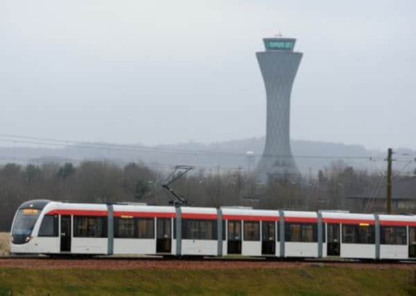 A tram runs past Edinburgh Airport. Picture: Neil Hanna