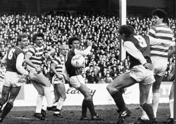 Steve Cowan (No. 9) scores in a barnstorming Scottish Cup tie at Easter Road in 1986. Hibs prevailed over Celtic 4-3. Picture: Denis Straughan