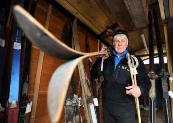Tighe with a pair of wooden laminated skis made by Norwegian manufacturer Madshus in the 1960s. Picture: Jane Barlow