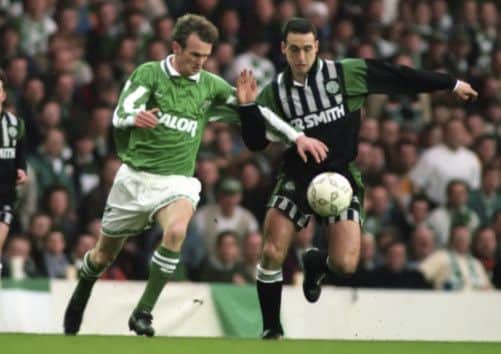 Paul McStay is challenged by Michael O'Neill. Picture: SNS
