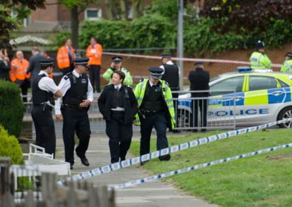 Police man a cordoned off area in Woolwich following the attack. Picture: AFP