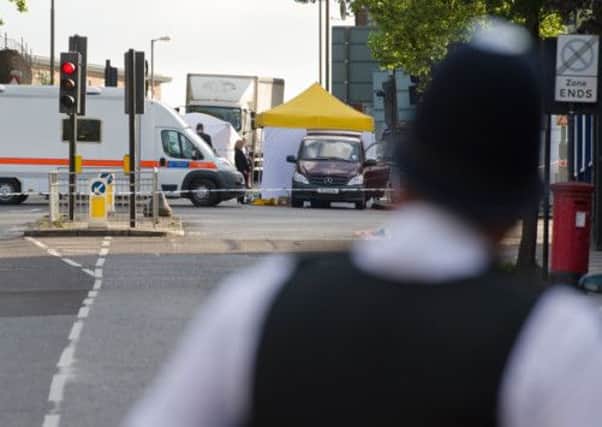 Police forensics tents and officers are seen in Woolwich. Picture: Getty