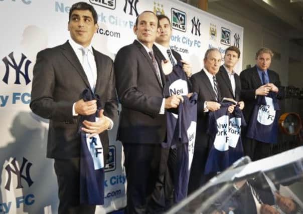 From left, Claudio Reyna, MLS Commissioner Don Garber, Manchester City CEO Ferran Soriano, New York City Mayor Michael Bloomberg, New York Yankees general manager Hal Steinbrenner and president Randy Levine. Picture: AP
