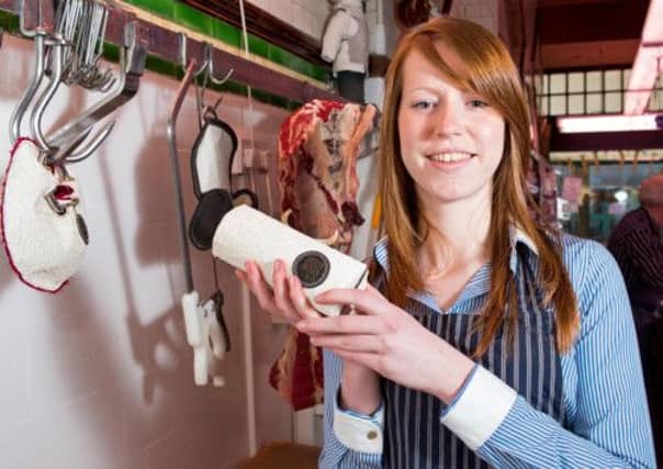 Jocelyn Mather with one of her purses. Picture: HE Media