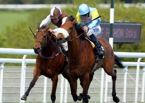 Elik, right, and Ryan Moore, on their way to winning the Height of Fashion Stakes at Goodwood. Picture: PA
