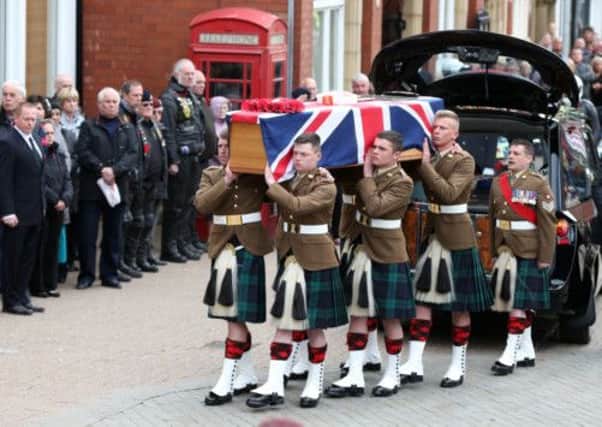 The funeral procession of Fusilier Samuel Flint. Pictures: PA