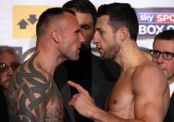 Carl Froch and Mikkel Kessler confront each other during the weighin at the O2 Arena yesterdayP. icture: Getty