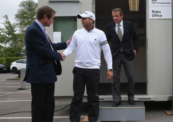 Sergio Garcia emerges from a meeting in the rules office with George O'Grady and Tim Finchem. Picture: Getty