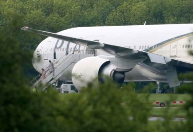 Passengers disembark Pakistan International Airlines flight PK709 at Stansted Airport. Picture: PA